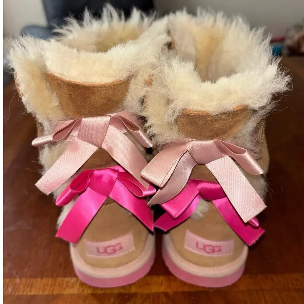 UGG kids’ Bailey Bow II chesnut brown and pink boots with bows on back (size 5)